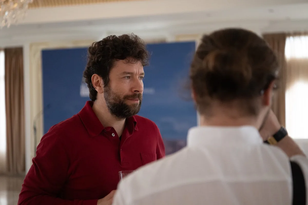 A Snoika team member in conversation at an event
