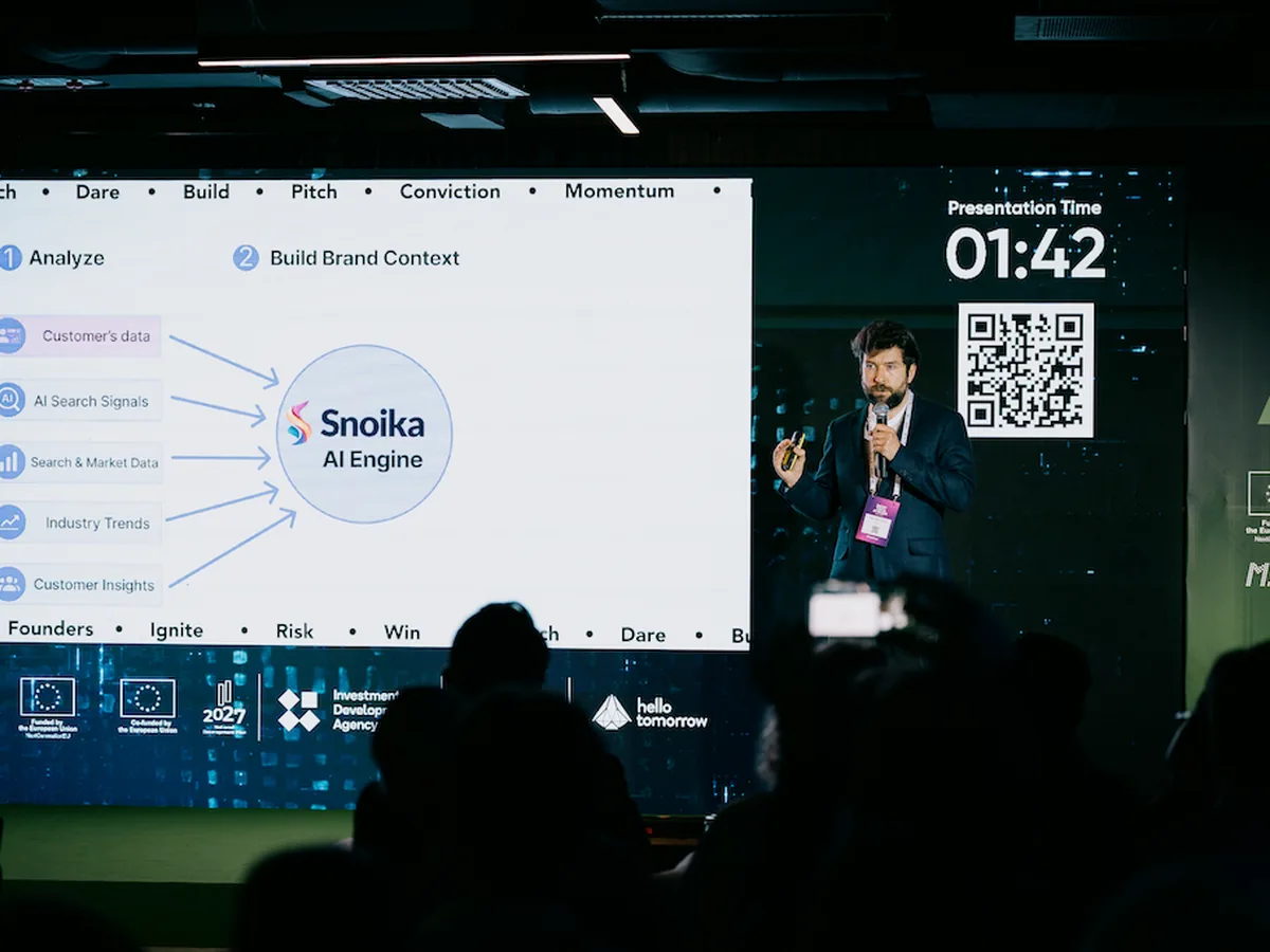 A Snoika team member presents the Snoika AI engine on stage